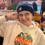 Photo courtesy Faith Jansen
Faith Jansen, a vendor at the Shipley Center Holiday Bazaar, shows off one of her handmade hats.