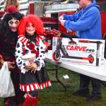 Photo by Monica Berkseth/
Dad and daughter duo Nick Romano Danielle Romano, 8, celebrate winning a scooter at the Sequim Prairie Granges Country Fair and Trunk-or-Treat for its Great Candy Drop on Oct. 25 held by Clallam County Fire District 3.