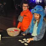 Sequim Gazette photo by Matthew Nash/
Hailey Hoyle, 9, as Stitch, and Zach Hoyle, 8, as a prisoner, play the Memory Game at the Sequim Boys & Girls Clubs Halloween Bash on Oct. 25.