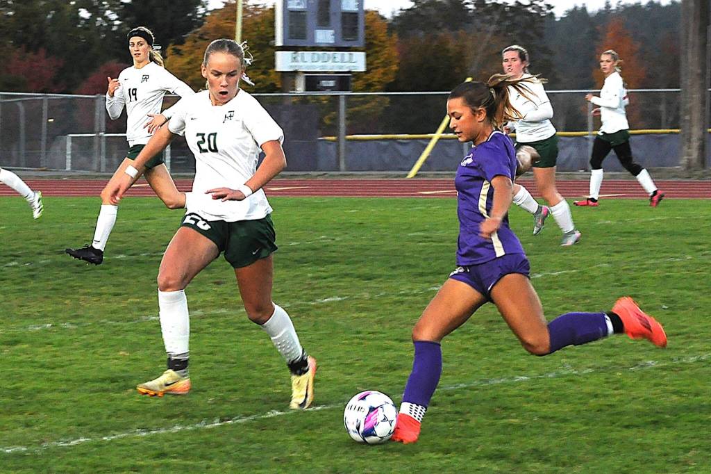 Sequim Gazette photo by Matthew Nash/
Sequims Ruby Moxley-Horgan advances the ball against Port Angeles Emma Deshardins (20) on Tuesday in Sequim. The Roughriders scored three goals in the second half to win 3-1.