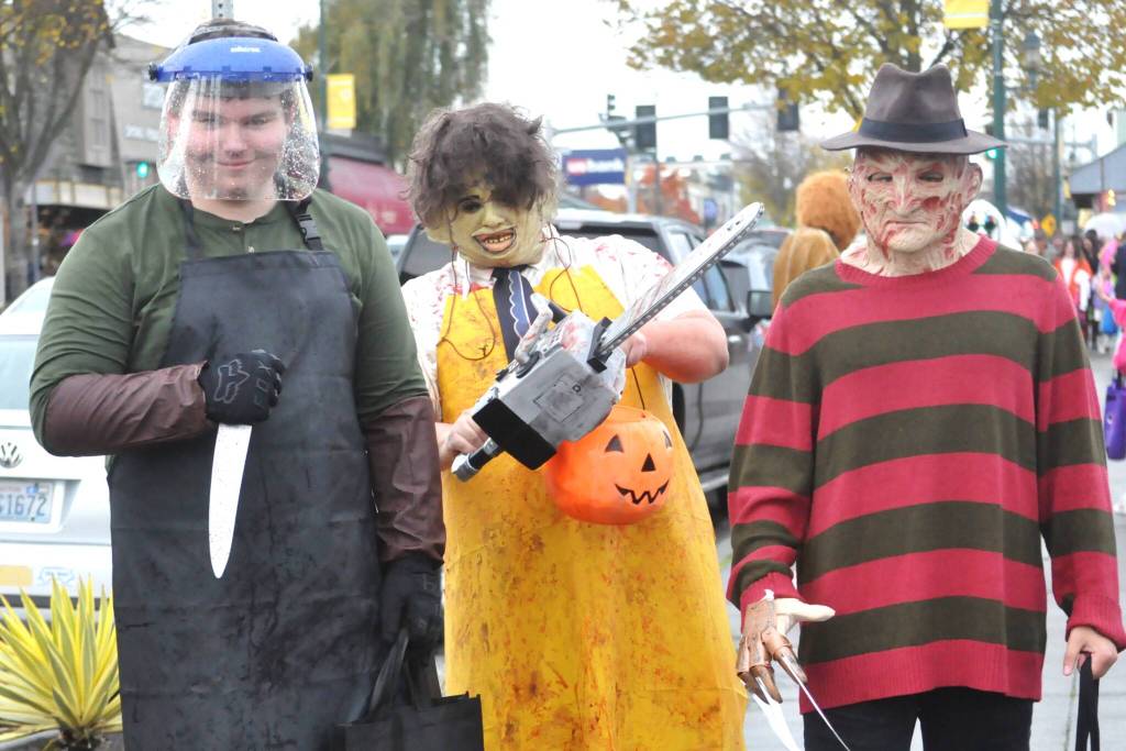 Sequim Gazette photo by Matthew Nash
Horror icons, from left, Dexter Morgan (Hayden Blagdon), Leatherface (Kingston Stevens) and Freddy Krueger (Michael Lusk) provide the scares on Halloween in downtown Sequim. The friends said theyre all fans of horror movies.