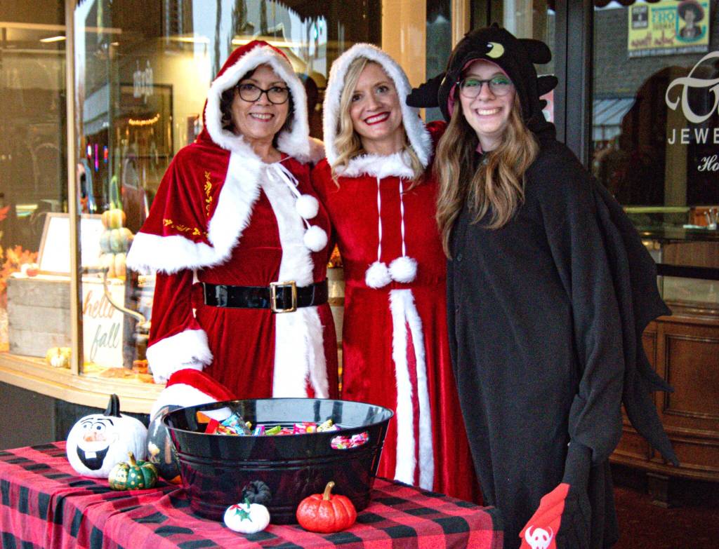 Photo by Monica Berkseth
Three generations of family, from left, Deborah Hunt, Libby Rogers, and Cadence Rogers, owners of Coles Jewelers, get in the Halloween and Christmas spirit during the Sequim Merchants trick-or-treat event.