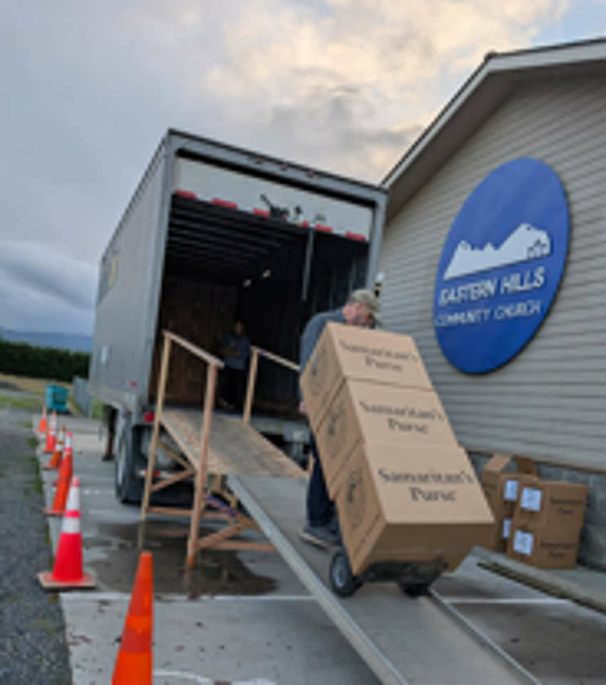 Photo courtesy Operation Christmas Child/ John Schvetz, central drop-off coordinator, hauls cartons of shoebox gifts into a truck headed for an Operation Christmas Child Processing Center, starting their journey to needy children around the world in 2024. He will do the same this year.
