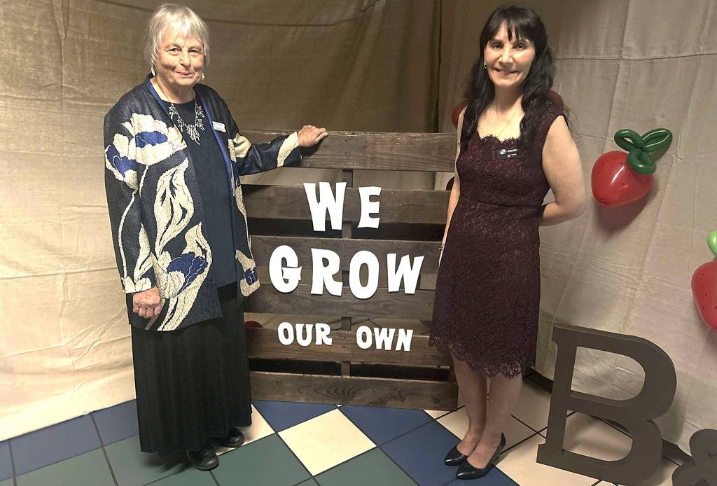 Sequim Gazette photo by Kathy Cruz/ Norma Turner, left, board president of the Boys and Girls Clubs of the Olympic Peninsula, and Executive Director Mary Budke greeted guests as they arrived at the Sequim Boys and Girls Club for the annual auction and fundraiser Saturday evening, Nov. 8.