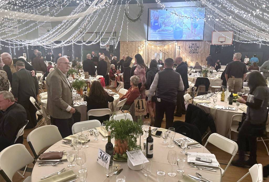 Sequim Gazette photo by Kathy Cruz
The gym at the Sequim Boys and Girls Club was transformed for the dinner and auction, themed We Grow Our Own, with 400 guests seated among 40 tables, each with 10 place settings.