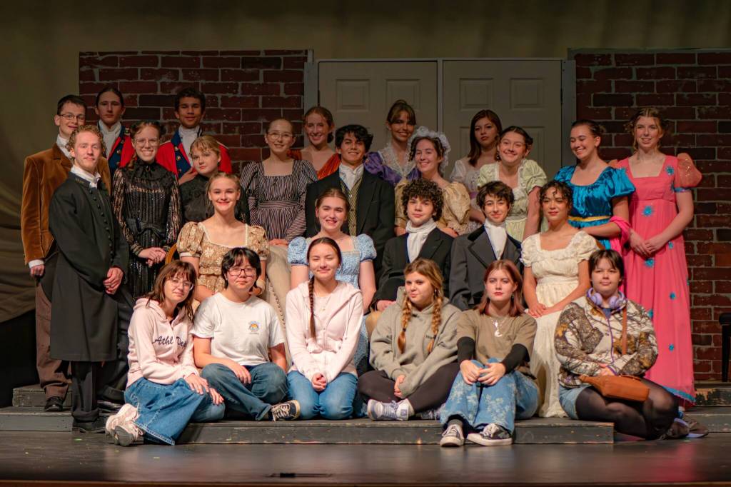 The cast and crew of the Sequim High School production of Pride and Prejudice gather for a group photo.
