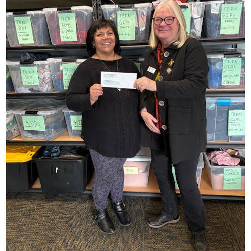 Photo courtesy Sequim Soroptimists
Roxann Harr, right, president of Soroptimist International of Sequim, presents a check for $1,000 to Cathy Bourm, the Sequim School Districts educational support specialist, to support students who fall under the McKinney-Vento Act. The McKinney-Vento Homeless Assistance Act is a federal law that ensures homeless children and youth have immediate and stable access to education. According to the Act, homeless children and youth are defined as those who lack a fixed, regular, and adequate nighttime residence. The funds will be used in various ways to support the stability of these children and youth while they attend school.