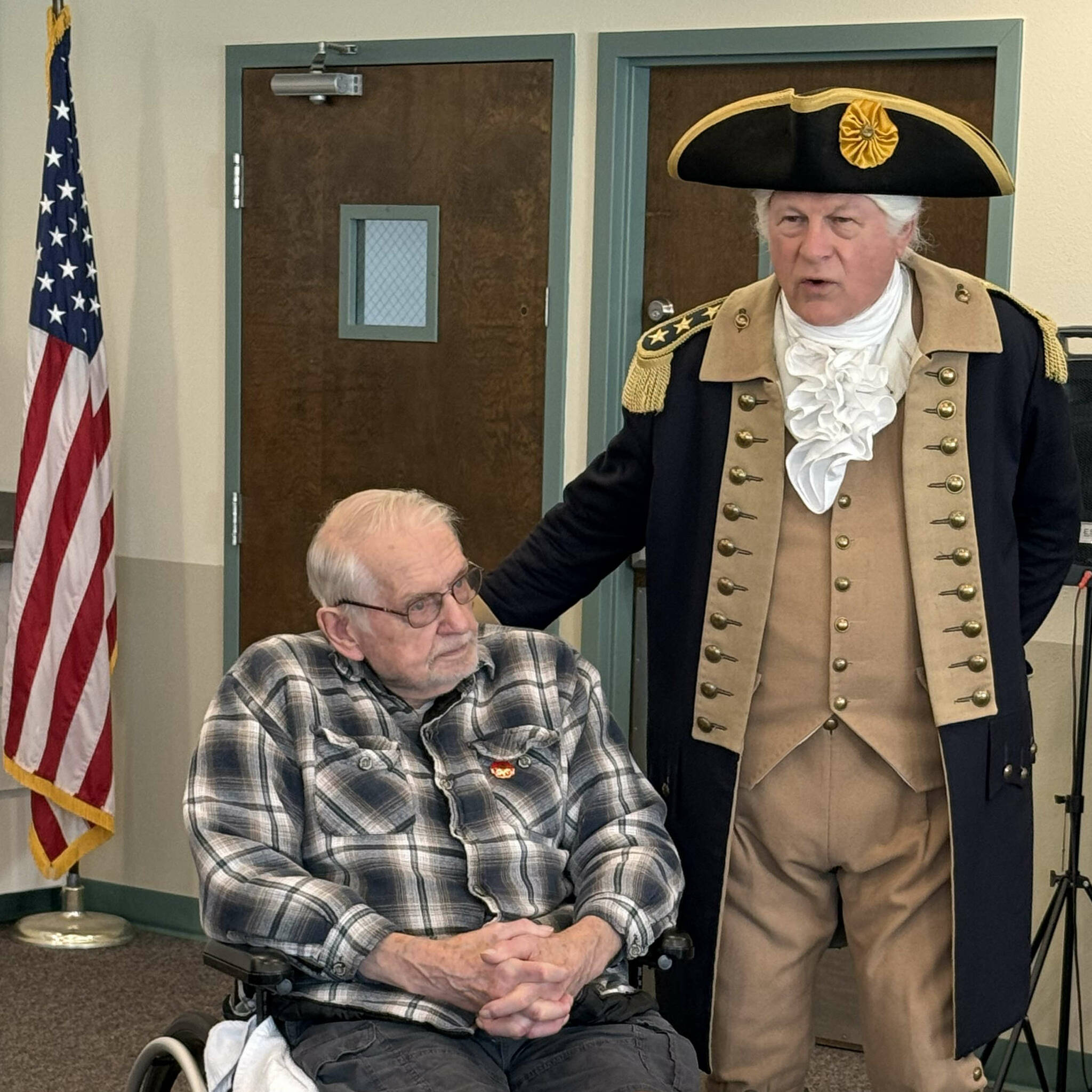 Photo courtesy New Dungeness Chapter DAR/ Vern Frykholm, who has made more than 500 appearances as George Washington since 2012, visits with Dave Spencer. Frykholm and 10 members of the New Dungeness Chapter, NSDAR visited with about 30 veterans on Nov. 8, just ahead of Veterans Day.
