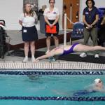 Photo courtesy of Eric Ellefson/
Ava Shinkle tags the wall after swimming the butterfly portion of the 200 IM relay as teammate Holland Sol takes off to finish the relays freestyle portion. They and Naomi Beglyakov and Annie Ellefson finished 18th in state.