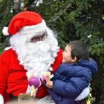 Sequim Gazette photo by Monica Berkseth/ Four-year-old Jaxon Kober of Sequim doesnt hide his delight over the chance to visit with Santa by the community Christmas tree during Hometown Holidays in downtown Sequim on Saturday, Nov. 29.