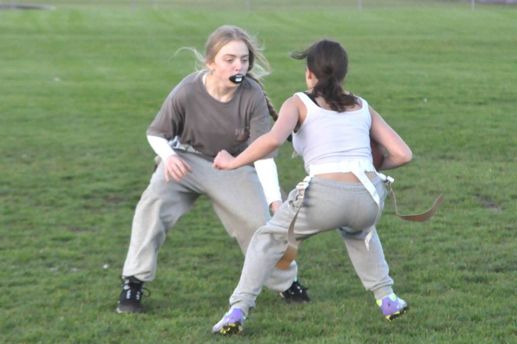 Sequim Gazette photo by Matthew Nash/
Olivia Jameson, right, looks to move past teammate Harlow Smith during a drill for SHS flag football team.