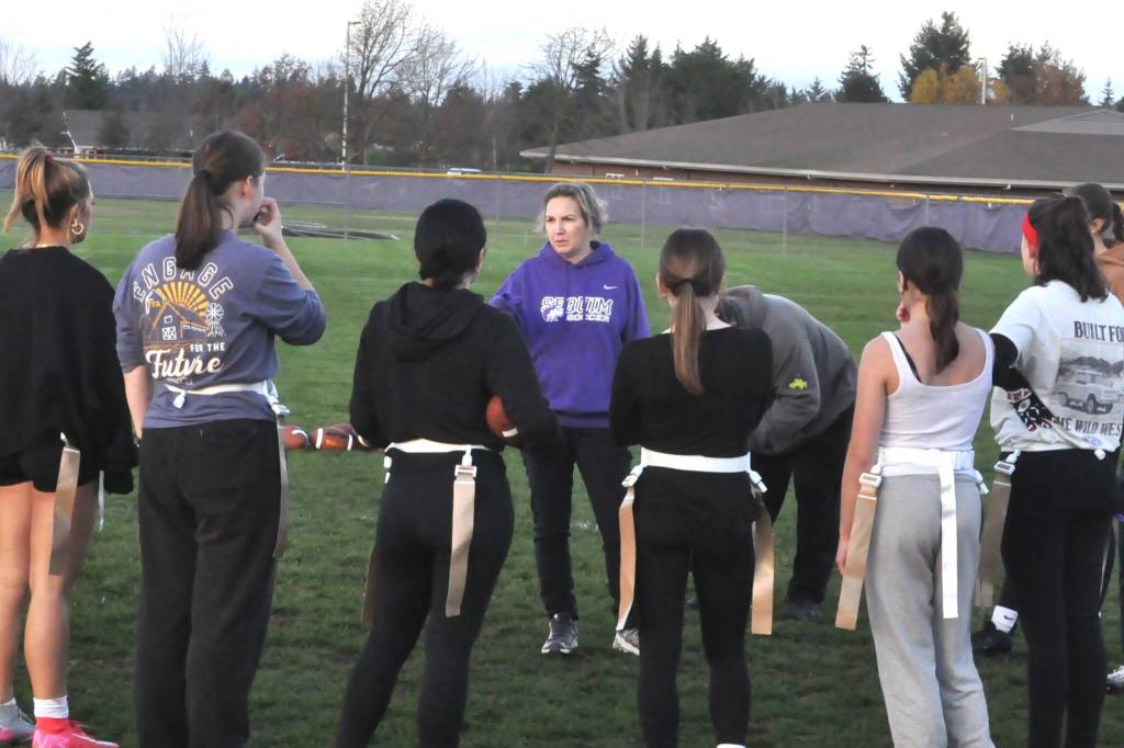 Sequim Gazette photo by Matthew Nash/
Coach Kathleen Rose gives directions to Sequims girls flag football team.