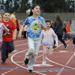 Sequim Gazette photos by Matthew Nash
Third grader Thea Thomas, center, is all smiles with classmates and her sister Essie at the start of Helen Haller Elementarys Turkey Trot fundraiser on Nov. 27.