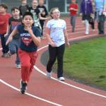 Julio Hernandez, a fourth grader at Helen Haller Elementary, runs hard to finish his last lap of the Turkey Trot.