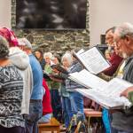 Photo by Emily Matthiessen/
Singers in the Sequim Community Christmas Chorus rehearse for the concert The Ages of Christmas, to be performed this Friday, Saturday and Sunday at the Sequim Seventh-day Adventist Church. This sacred music concert takes listeners on a trip through Christmas music history beginning in 990 AD and includes guest instrumentalists and sing-alongs.