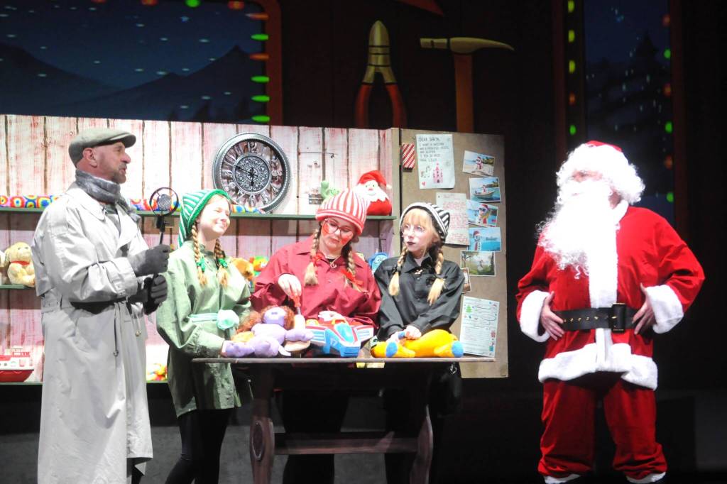 News reporter Andy Anderson (Greg Bova) interviews Santa (Joel Swenning) at the North Pole as elves Finky (Arwen Osborne), Winky (Rayna Buggy), and Stinky (Rain Nelson) make toys.