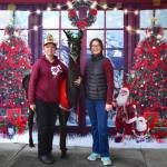 Sequim Gazette photo by Monica Berkseth/ Lily Chapman, left, and Paisley Warren, both 14, pose for a holiday photo with Spike the alpaca during the recent Falalallama Holiday Bazaar at the Sequim Masonic Lodge. The event benefited Olympic Peninsula Alpaca Rescue. The nonprofit is struggling financially.