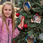 Sequim Gazette photo by Emily Matthiessen
Jewel Hill, a fourth grader at Helen Haller Elementary in Maribeth Stewarts class, shares the ornament she contributed to the Sequim Civic Centers holiday tree at a ceremony on Dec. 5. Working with the theme What brings you joy?, Hill said, Dragons are really important to me. They are majestic and cute; theyre awesome.