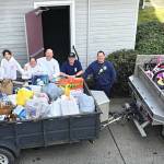 Photo courtesy Marc Lawson, CCFD3/
Volunteers with Santas Toy and Food Fire Brigade gather up toy and bicycle donations on Dec. 13 to give to Sequim Community Aid for the groups annual Toys for Sequim Kids on Dec. 16.
