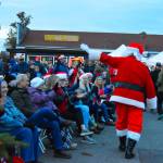 Sequim Gazette photo by Monica Berkseth/ Santa always receives a warm welcome during Sequims Hometown Holidays event, which kicks off the Christmas season.