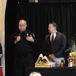 Sequim Gazette photos by Matthew Nash
Fire Chief Justin Grider with Clallam County Fire District 3, second from left, Community Paramedic Mark Karjalainen, and Capt. Kolby Konopaski speak with audience members of the Sequim-Dungeness Hospital Guilds annual volunteer luncheon about how the groups annual donations support the fire district, such as to purchase specialized equipment and training.