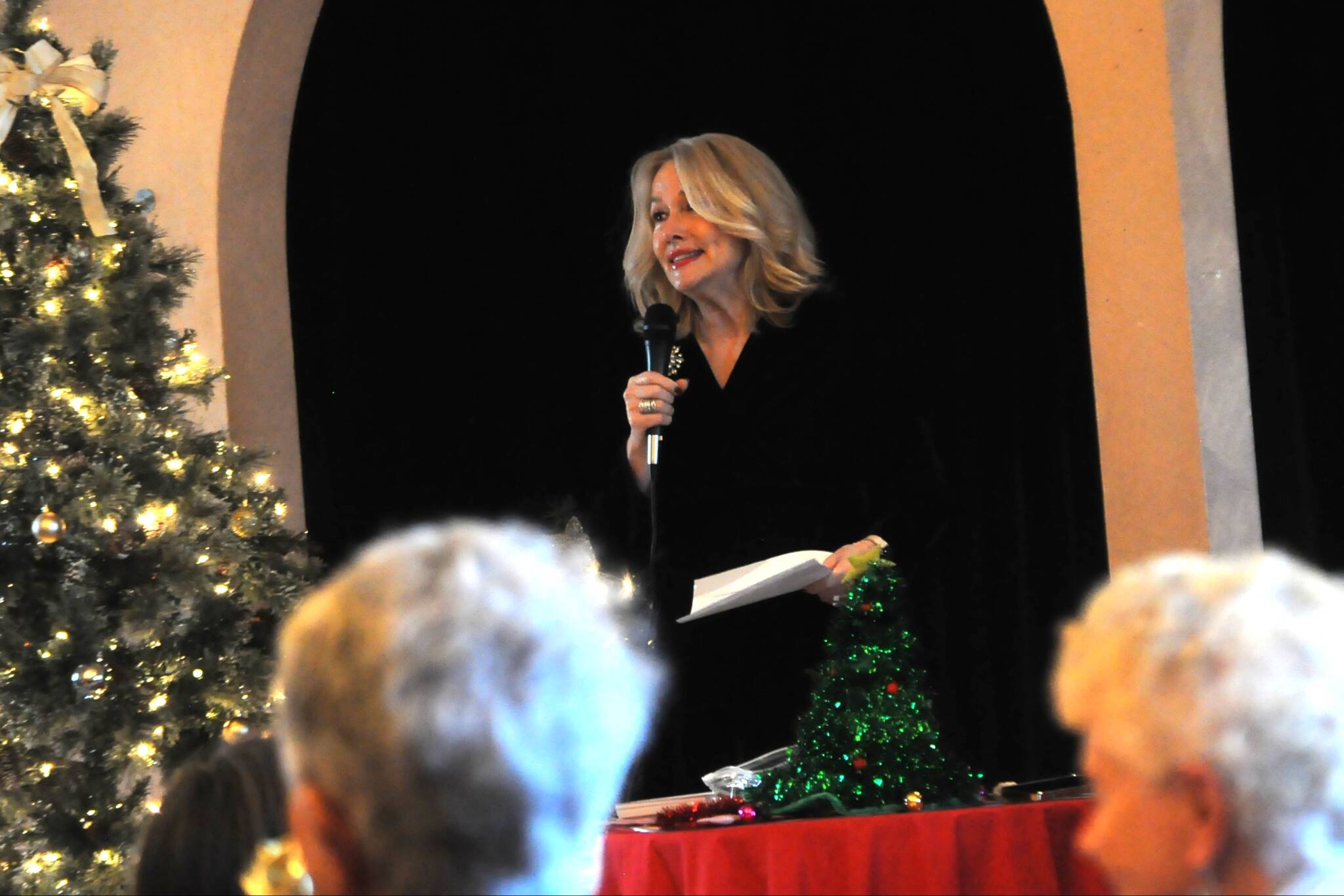 Sequim Gazette photo by Matthew Nash
Sandra Berryhill-Huish, vice-president of the Sequim-Dungeness Hospital Guild, emcees the groups annual volunteer appreciation event at Olympic Theatre Arts on Dec. 12. The all-volunteer group has given more than $2.5 million to medical and emergency efforts in the Sequim area.