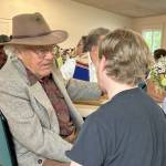 Sequim Gazette photo by Matthew Nash
The tribulations of Dungeness farmer Nash Huber made #2 on the Sequim Gazettes most read online stories of 2025. Huber  shown here greeting visitors during a May 17 benefit concert and dinner at Sequim Prairie Grange that raised funds for his medical and legal expenses  has faced eviction from Delta Farm by Washington Farmland Trust for alleged lease agreement violations. In an update to that situation, Washington Farmland Trust reports that the Hubers will vacate the farm in early 2026.