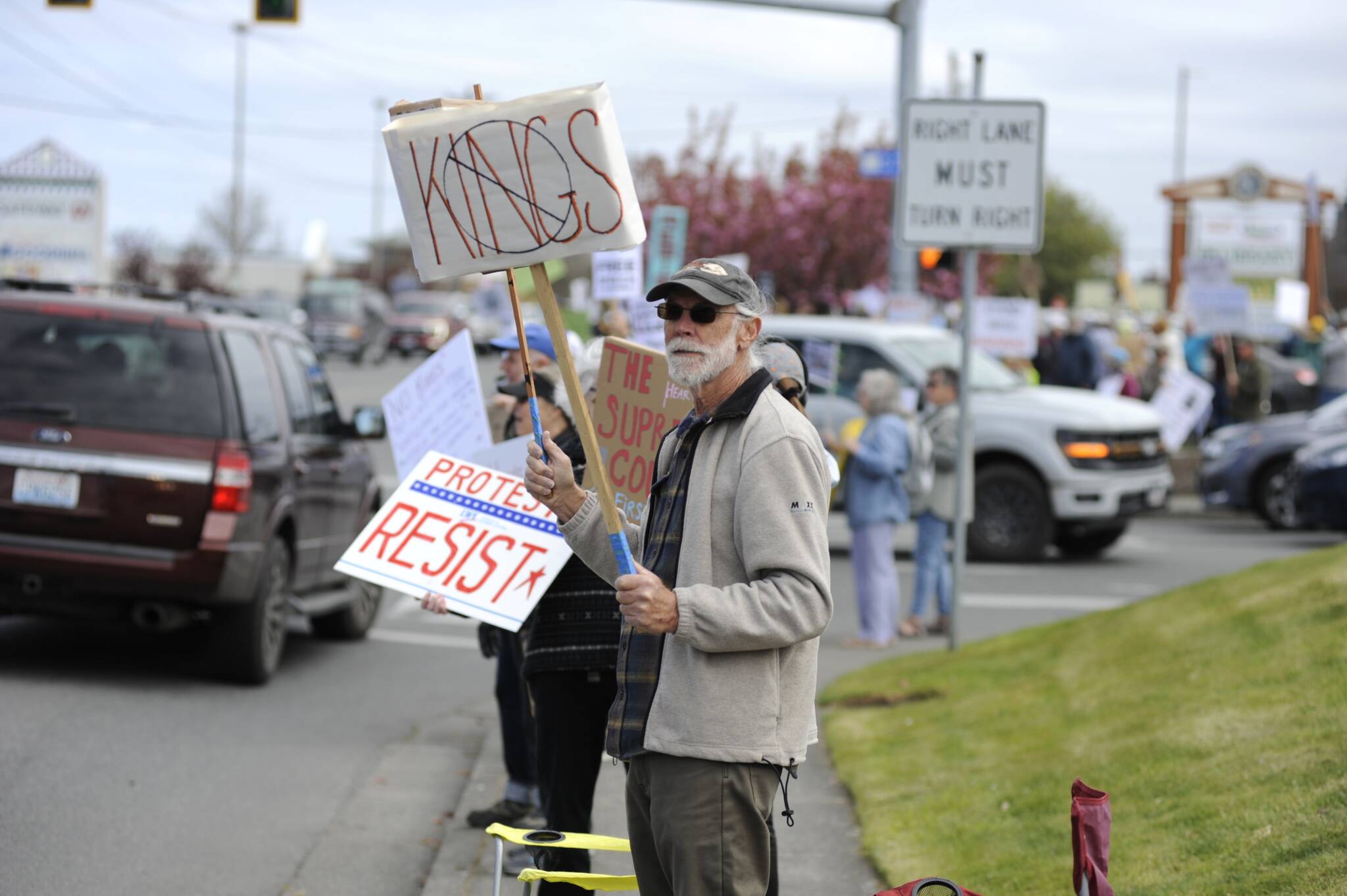 Sequim Gazette photo by Matthew Nash
Protests against the Trump administration were the fourth and ninth most-viewed articles on the Sequim Gazettes website in 2025. Here, Trevor Gloor of Sequim holds a sign that reads No Kings at a rally on Saturday, April 19. A similar protest on Saturday, Oct. 18 drew about 3,000 people  more than twice the crowd size of the April rally, according to organizers.