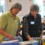 Patty Bacon, left, and Kathy Beery sort board games at Toys for Sequim Kids on Dec. 16. The two said theyve helped two years in a row now. Its a beautiful community effort, Bacon said.