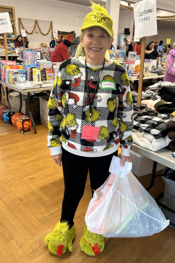 Sequim Gazette photo by Matthew Nash/
Sandra Granun, a volunteer for three years with Toys for Sequim Kids, said her Grinch outfit is inspired by her mantra that sometimes Im nice and sometimes naughty.
