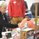 Sequim Gazette photo by Matthew Nash/
Nancy Garbush places a plushy for a lucky child for a parent/guardian to select and provide for their child on Christmas morning.