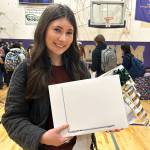 Sequim Gazette photo by Matthew Nash/
Kendra Dodson holds a new MacBook she received through the Winter Wishes assembly at Sequim High School on Dec. 16. Im just blown away by my teachers, she said. Our staff is very amazing. I feel very lucky.