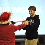 Sequim Gazette photos by Matthew Nash
Hayden Rayburn, a SHS choir member, receives a conducting baton at the SHS Winter Wishes assembly. He sang with both the choir and Vocal Ensemble at the assembly.