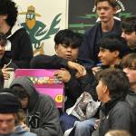 Sequim Gazette photo by Matthew Nash/
Friends of Grillien Morrill celebrate him receiving a box of chips during SHSs Winter Wishes assembly.