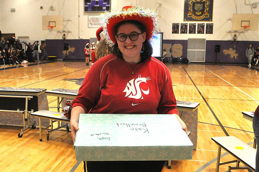 Kate Brouillard, a senior, said she was surprised to receive a laptop as a gift at the Winter Wishes assembly. She plans to attend Washington State University for a biology degree while pursuing a career in medicine.