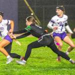 Photo by Emily Matthiessen/
Ruby Moxley-Horgan tries to avoid her flag being pulled during a match-up with Port Angeles.