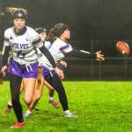 Sydney Thomas-Harris receives the ball as Lily Sparks (6) and Kiley Winter, in background, await the play to commence against Port Angeles on Dec. 18 in Sequim.