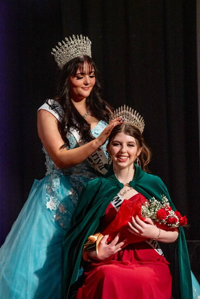 Sequim Gazette photo by Emily Matthiessen
Outgoing Irrigation Festival queen Ariya Goettling crowns incoming Queen Lily Tjemsland at the Royalty Ambassador Scholarship Pageant on Feb. 22 in Sequim High Schools auditorium. Along with Tjemsland, Malachi Byrne. Joanna Morales and Roxy Woods were chosen for the 2025 royalty.