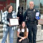 Sequim Gazette photo by Matthew Nash
Mamba the dog sits at the Sequim Civic Center with her family – Sequim Police Officer Paul Dailidenas, his wife Linda, left, and their daughter Alyssa on March 10 after Dailidenas and Mamba received a Distinguished Medal. Mamba retired from service after nearly eight years, and Sequim is training another officer and dog to take over the K-9 Officer Program with Dailidenas blessing.