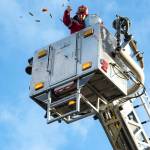 Sequim Gazette photo by Monica Berkseth
Firefighter John McKenzie with Clallam County Fire District 3 throws candy into the air at the Sequim Prairie Granges Country Fair and Trunk-or-Treat for its Great Candy Drop on Oct. 25.