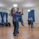 Sequim Gazette photo by Emily Matthiessen/
Competitive dance champion and ballroom dance instructor Werner Figar leads student Debra Van Dusen in a waltz, while other students circle the room at Old Dungeness Schoolhouse in January 2025.