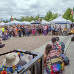 Sequim Gazette photo by Emily Matthiessen
Clallam Countys first poet laureate, Jaiden Dokken, shares a poem about love with a crowd gathered at the Sequim Farmers and Artisans Market on June 28 for Sequims Pride Celebration on the anniversary of the 1969 Stonewall Riots. Speakers addressed subjects such as human rights, the history of the LGBTQIA+ movement, love and solidarity. This year marks the fourth time the celebration was held in Sequim, with a larger turnout each year.