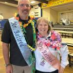 Sequim Gazette photo by Matthew Nash/ Eric Danielson and Christine MacDougall Danielson stand together before the fifth grade Moving On ceremony at Helen Haller Elementary on June 12 and on their last day before retirement. Eric retired as a fifth grade teacher and Christine as a reading specialist at the elementary school. They retired on June 12 after 30-plus years teaching.
