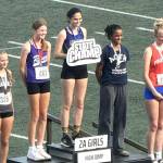 Photo courtesy Brad Moore/ Sequims Clare Turella receives a first place medal in the Washington state 2A track and field meet in Tacoma on May 30 after she jumped 5-4 to win the title this year. She jumped 5-2 in 2024 to win the title as a freshman.