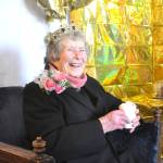 Sequim Gazette photo by Matthew Nash
Joan Butler receives a sweet drink as a gift during her 100th birthday party in Diamond Point on Dec. 19.