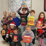 Photo courtesy Sandra Carlson
Students in Jennifer Newtons second grade class at Greywolf Elementary celebrate donations they gave during 12 Days of Giving. For their efforts to donate to Sequim Food Bank, they received extra recess time.