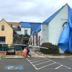 Sequim Gazette photo by Matthew Nash
Integrity Roofing and Construction started work last week to replace Olympic Theatre Arts roof. The theaters box office is closed through Jan. 19 until construction is finished.