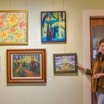 Sequim Gazette photo by Monica Berkseth
Anne Milligan, owner of A. Milligan Art Studio & Gallery at 520 N. Sequim Ave., stands near some of the pieces contributed by members of the Olympic Peninsula Art Association for a show to raise funds for art scholarships.