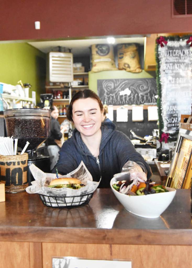 Sequim Gazette photo by Monica Berkseth/ Rainshadow Cafe employee Maizie Reidel serves up orders at the popular eatery located at 157 W. Cedar St.