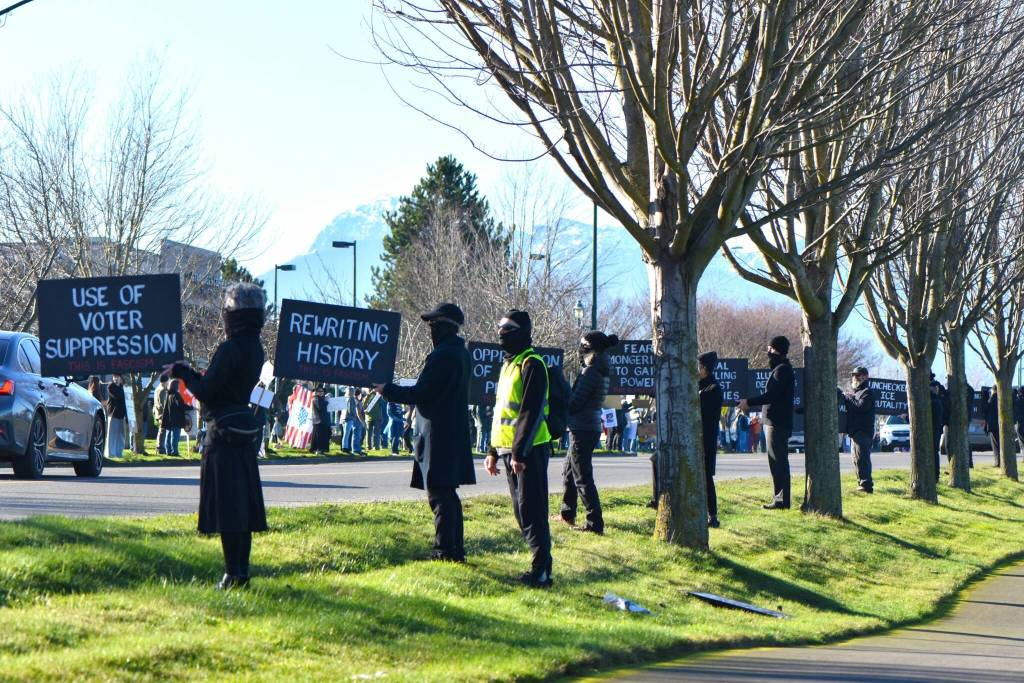 Sequim Gazette photo by Monica Berkseth/
Peaceful protesters gather along Washington Street on Jan. 19 (Martin Luther King Jr. Day) during an event organized by Indivisible Sequim.